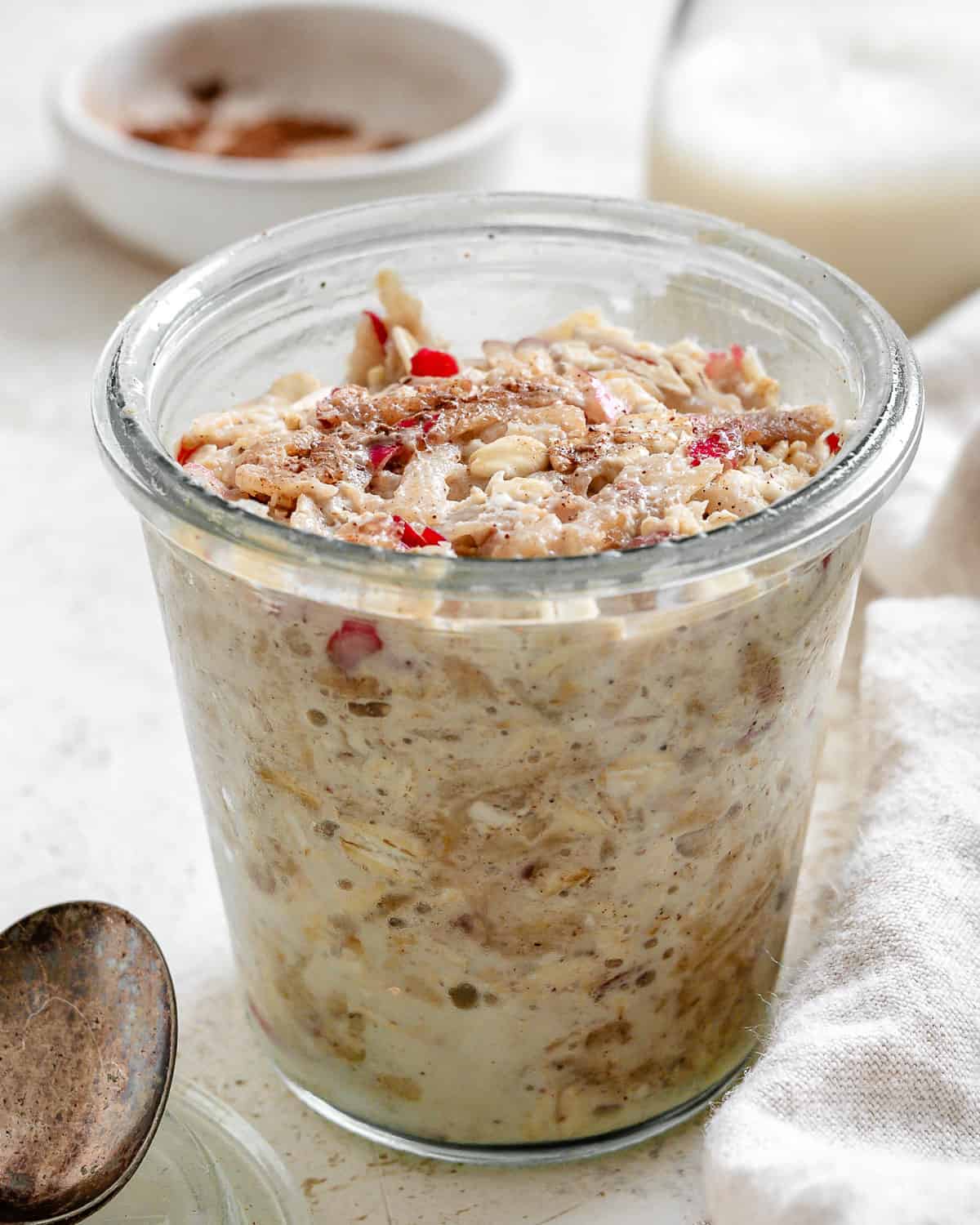 completed Apple Cinnamon Overnight Oats in a gl، cup
