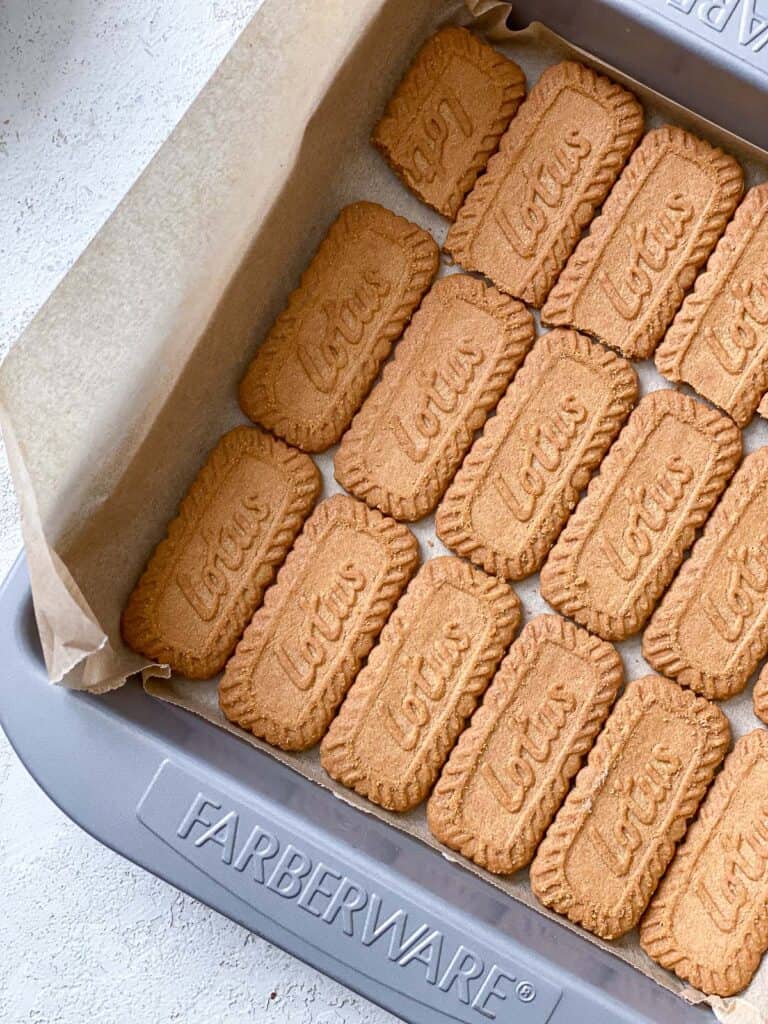 layer of biscoff cookies in baking dish