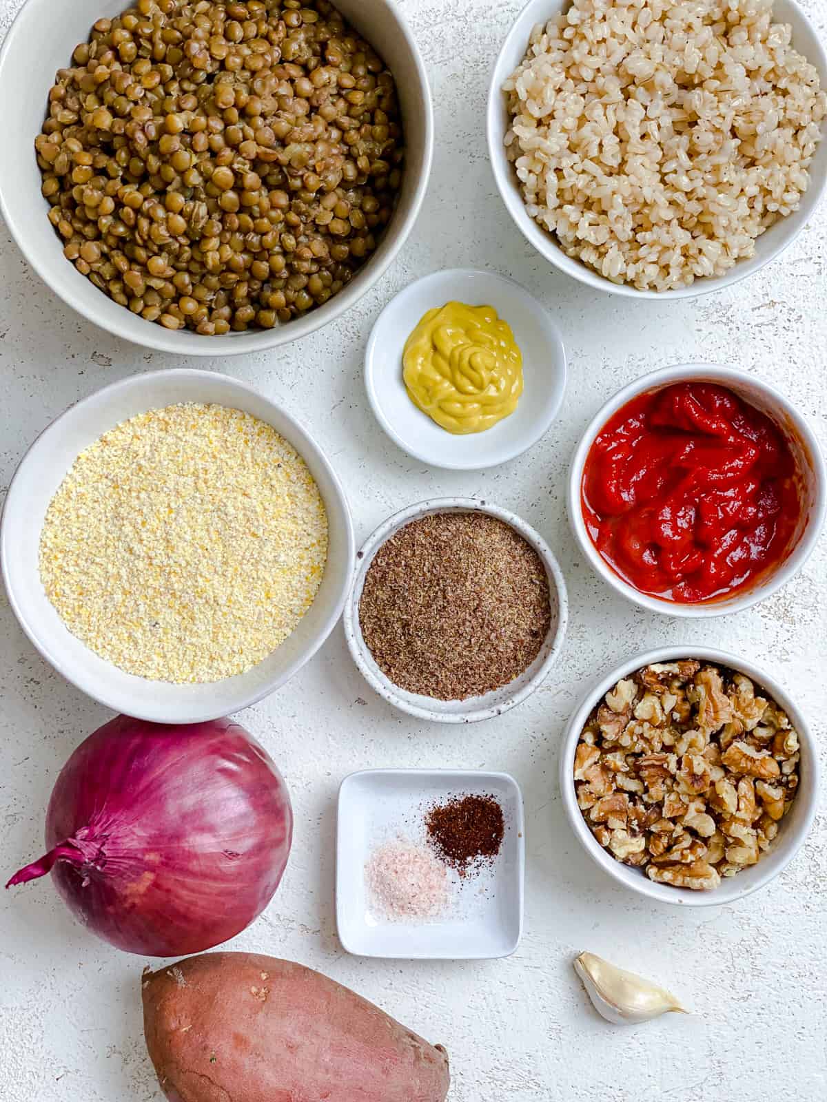 ingredients for The Best Vegan Lentil Burgers measured out on a white surface