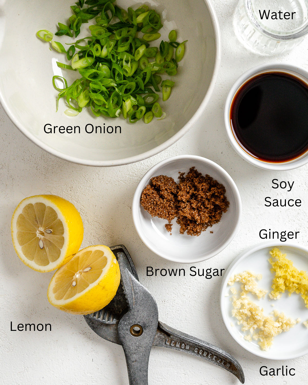 measured out ingredients for Vegan Garlicky-Ginger Tofu Triangles on a white surface