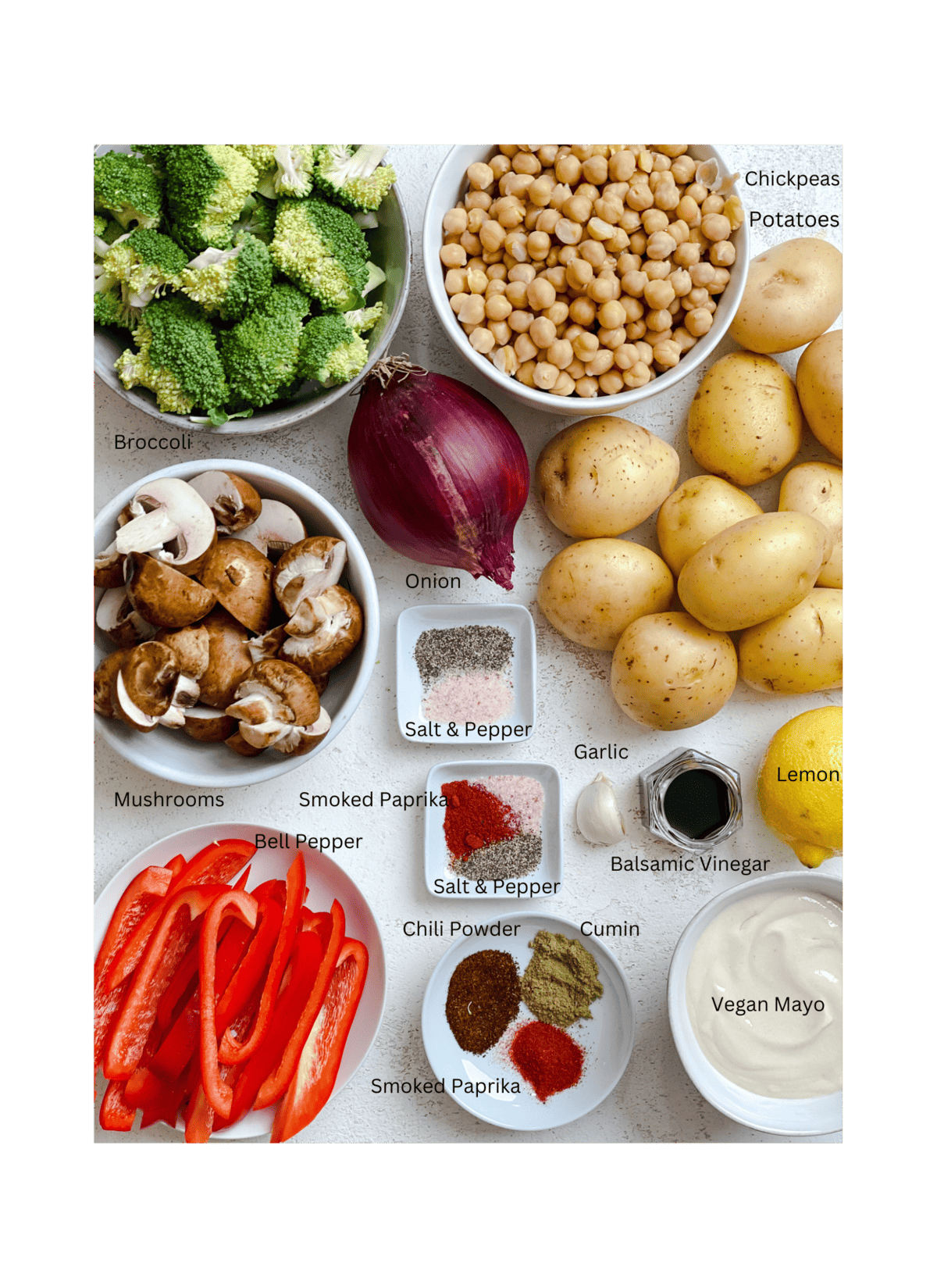 ingredients for Healthy Roasted Potato Salad measured out on a white surface