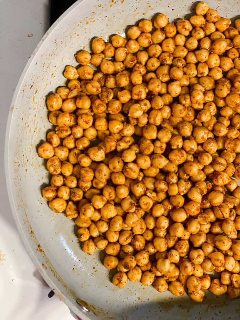 process shot of chickpeas cooking in pan