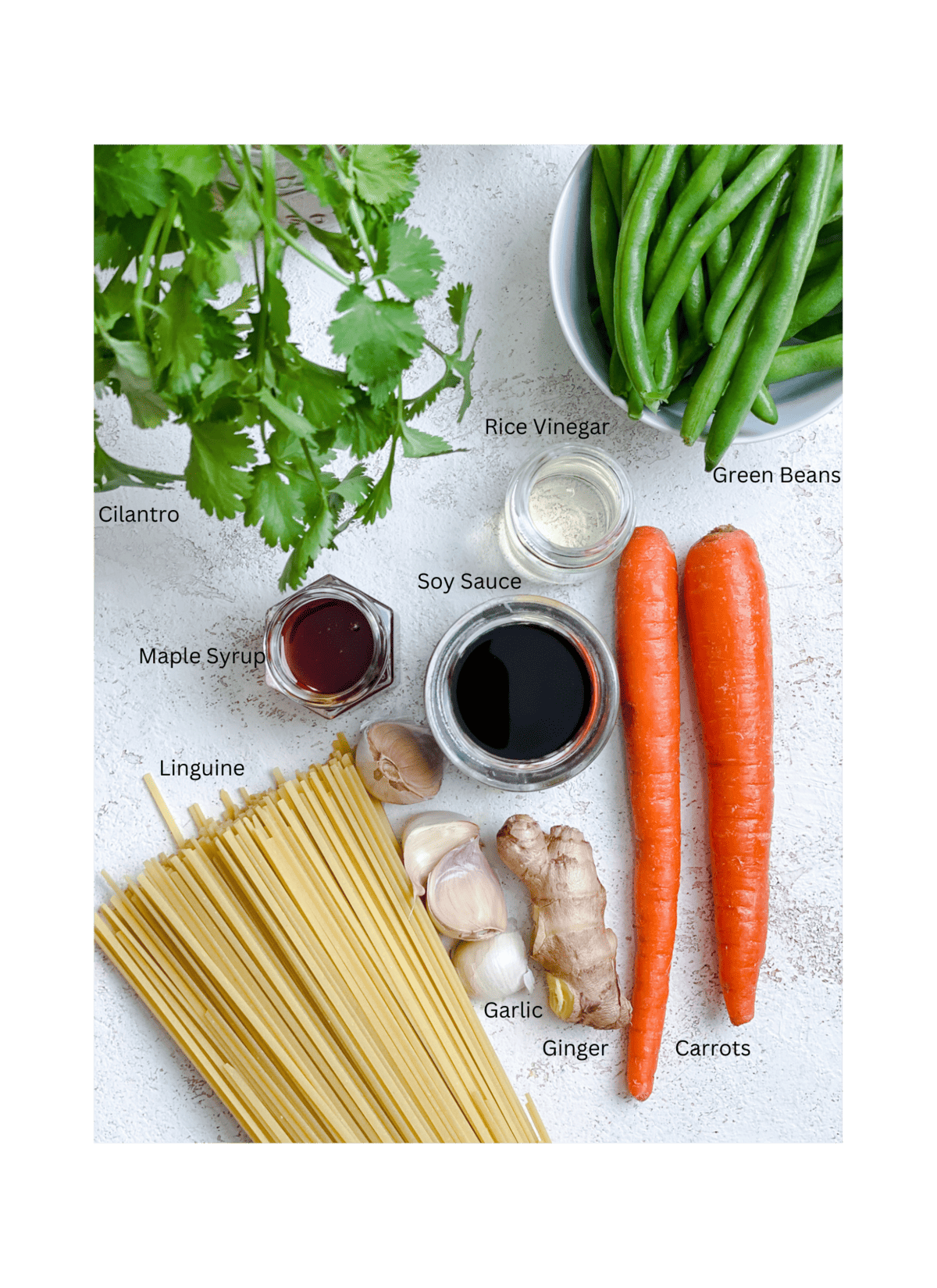 ingredients for Easy Teriyaki Noodles measured out against a white surface