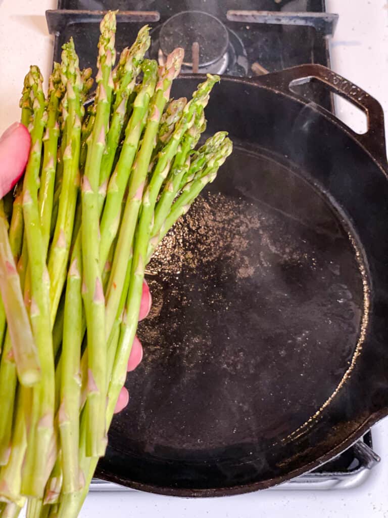 process s،t of adding asparagus to pan