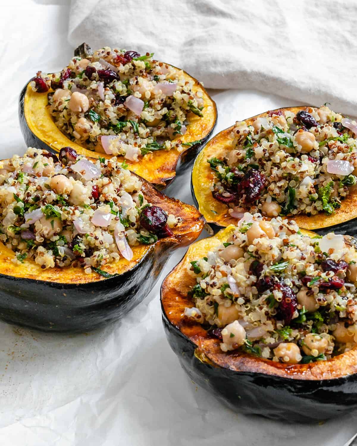 completed Vegan Stuffed Acorn Squash [With Quinoa] on a baking dish