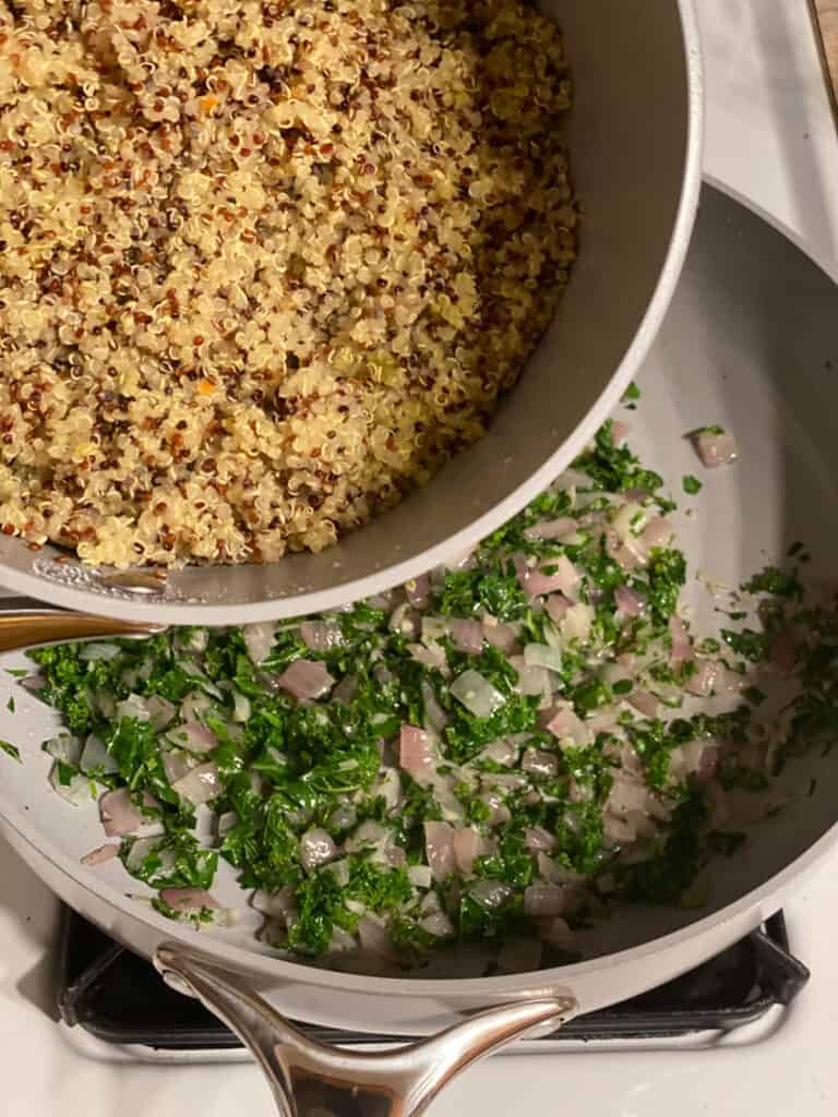 process shot of quinoa being added to pan