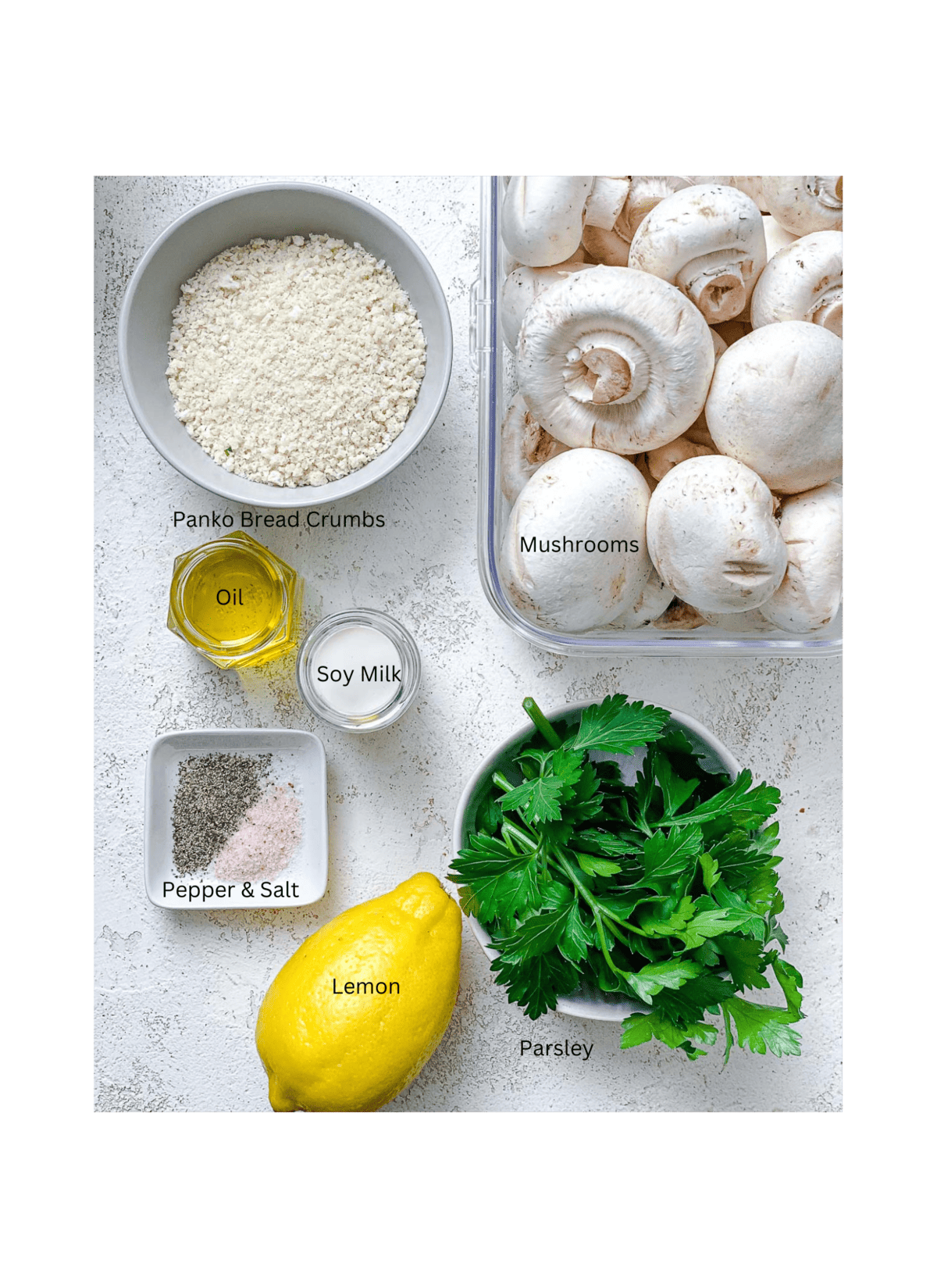 ingredients for Easy Vegan Stuffed Mushrooms measured out against a white surface