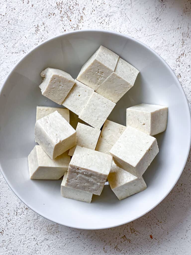 cubed tofu on a white bowl