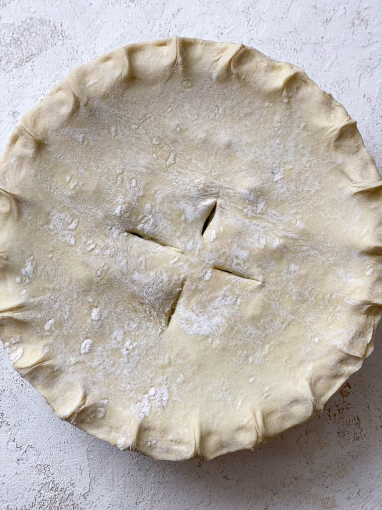 unbaked Mixed Vegetable Vegan Pot Pie on white surface