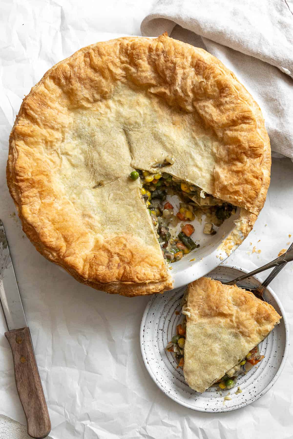 completed Mixed Vegetable Vegan Pot Pie a،nst white surface