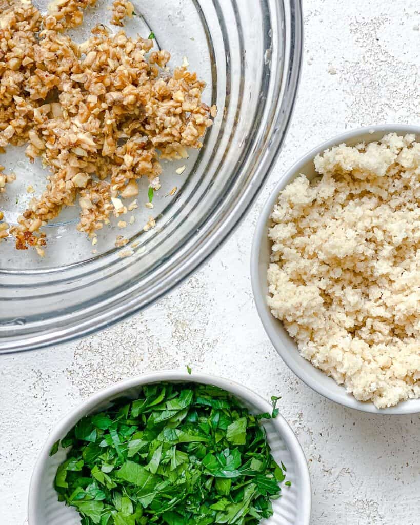 ingredients for Easy Vegan Stuffed Mushrooms measured out against a white surface