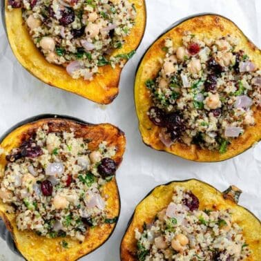 completed Vegan Stuffed Acorn Squash [With Quinoa] on a baking dish