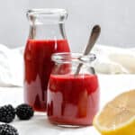completed 5-Minute Blackberry Vinaigrette in two glass jars
