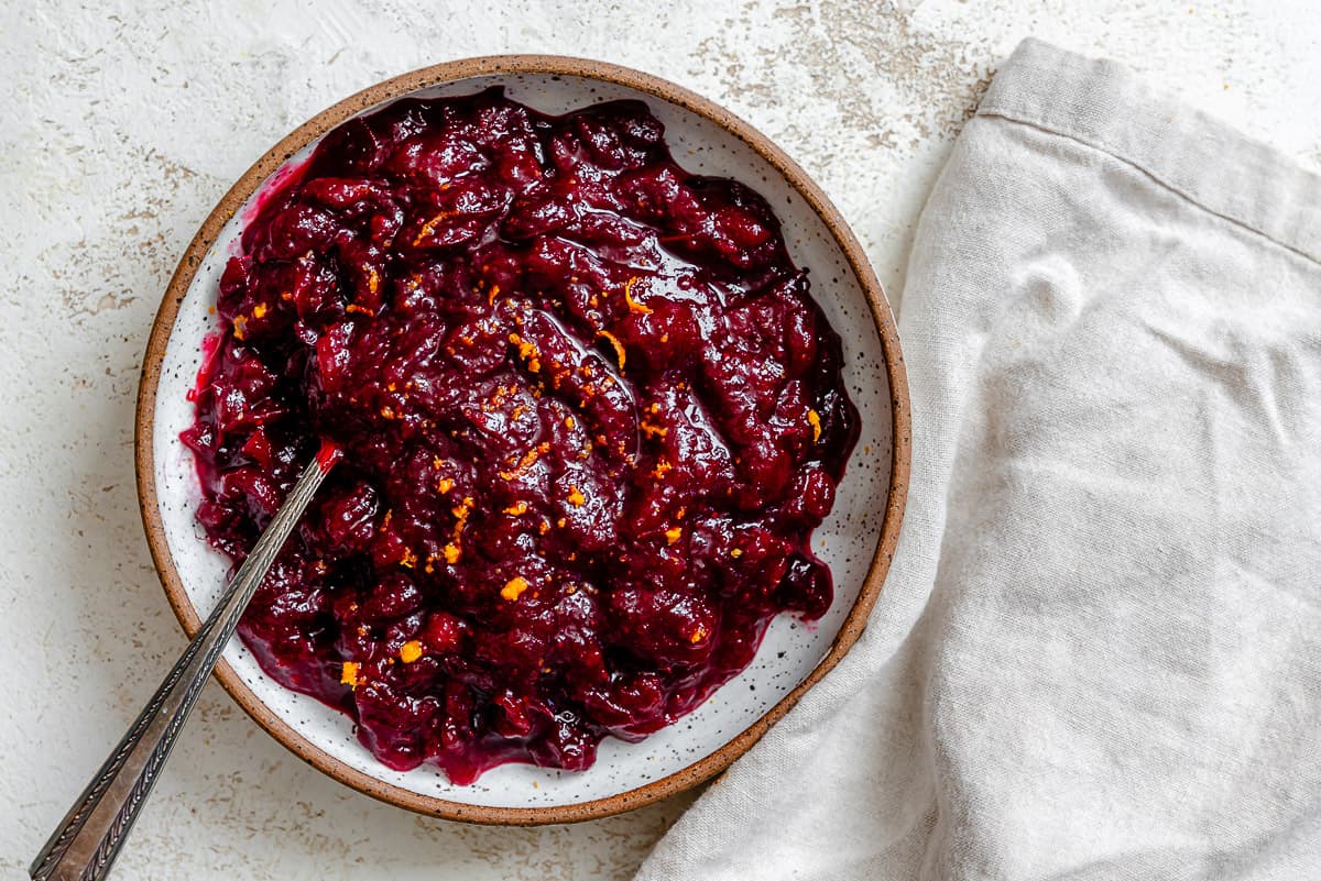 completee Easy Cranberry Sauce with Orange Juice on a white surface
