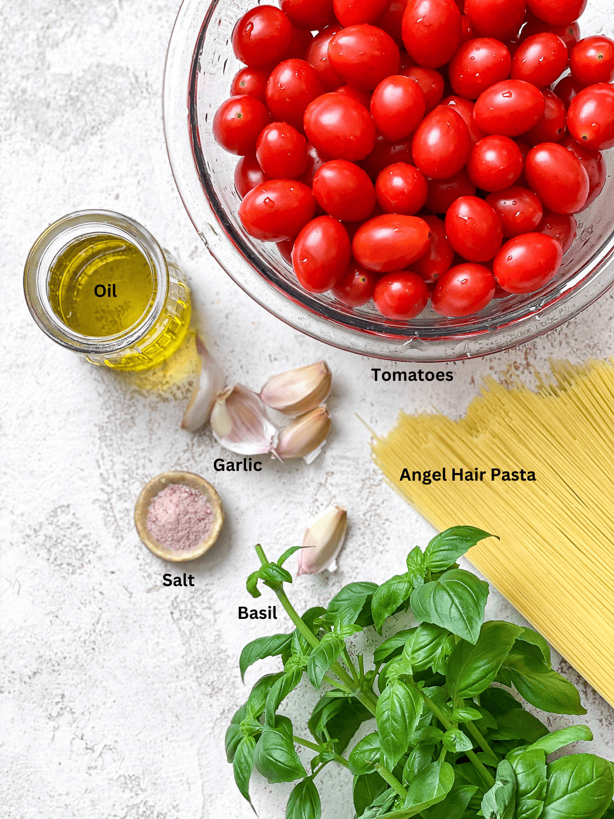 ingredients for 15-Minute Cherry Tomato Basil Pasta on a white surface