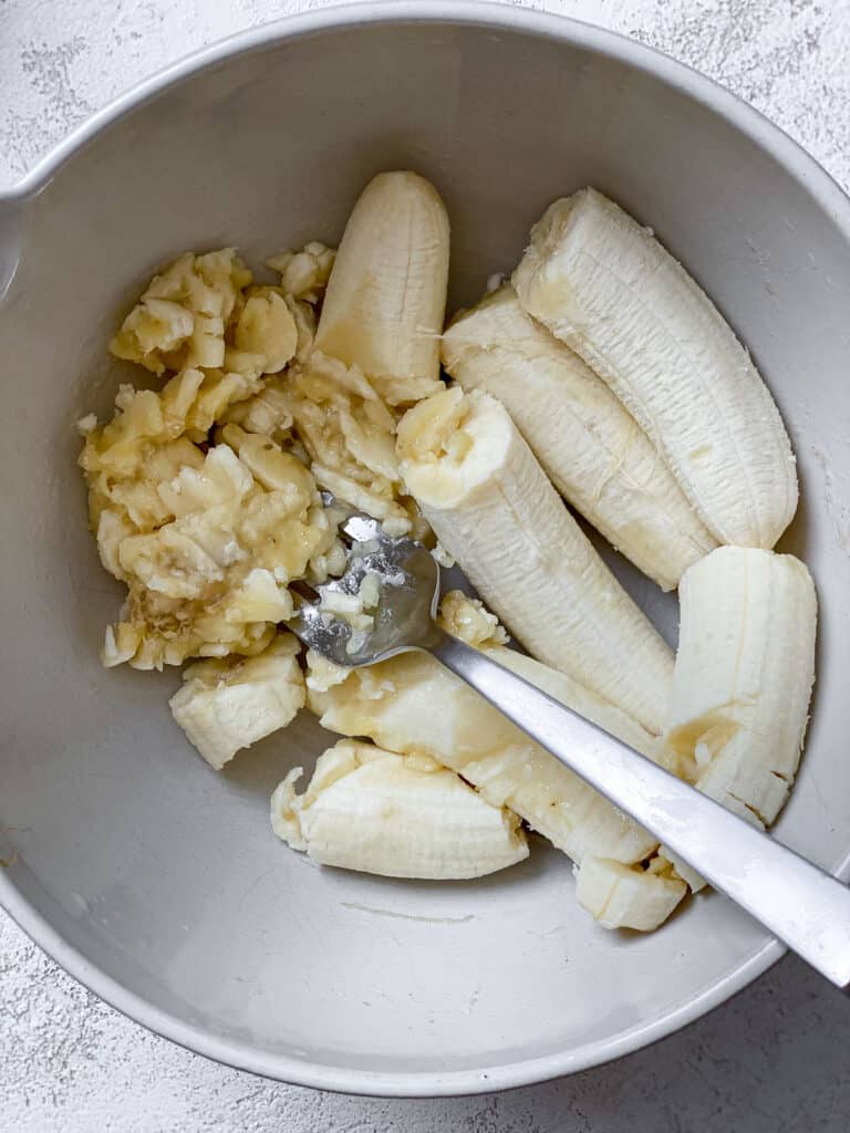process shot of mashing banana in bowl