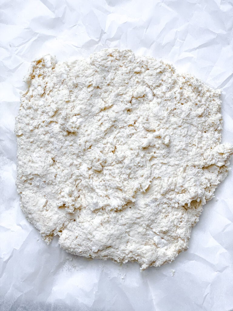 dough spread out on a white surface