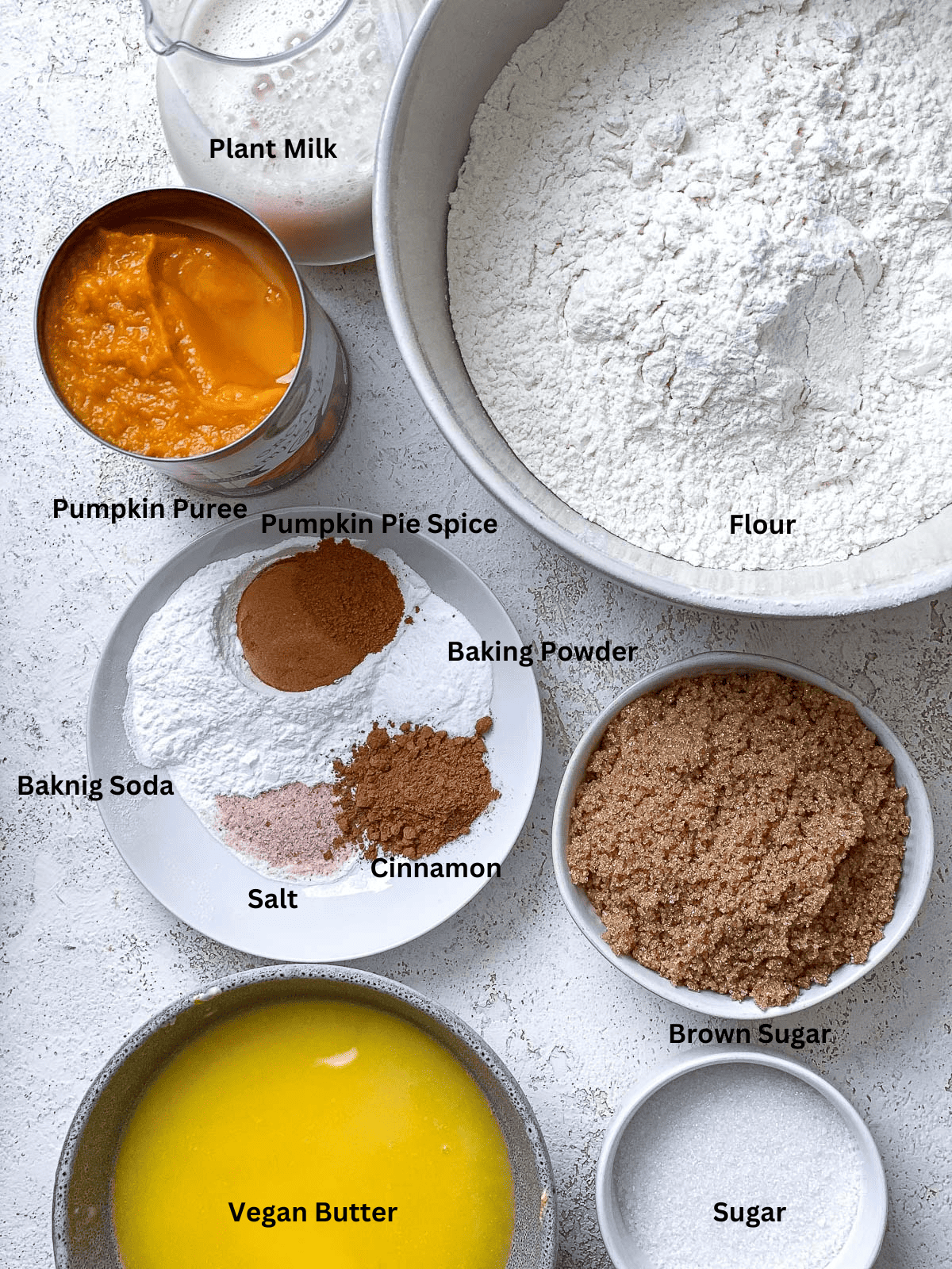 ingredients for Easy Pumpkin Bundt Cake measured on a white surface