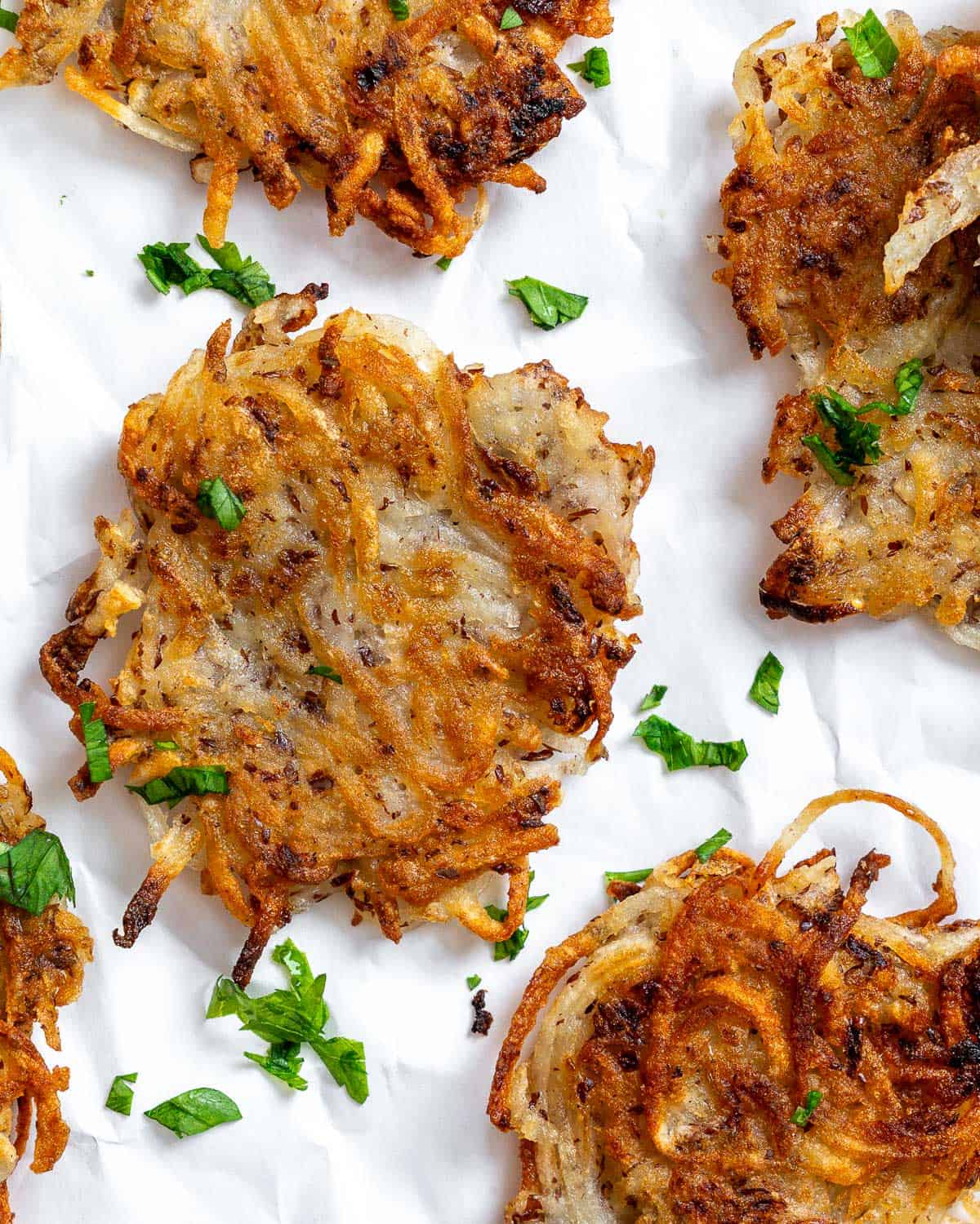 completed Vegan Potato Latkes on a white surface