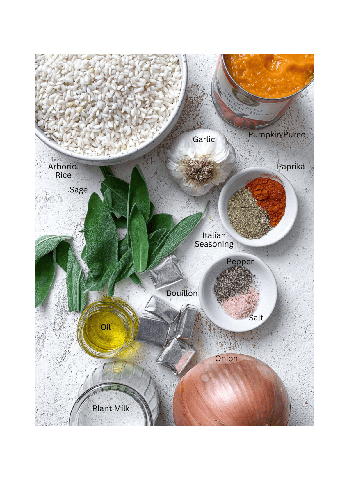 ingredients for Creamy Pumpkin Risotto (Vegan) on a white surface