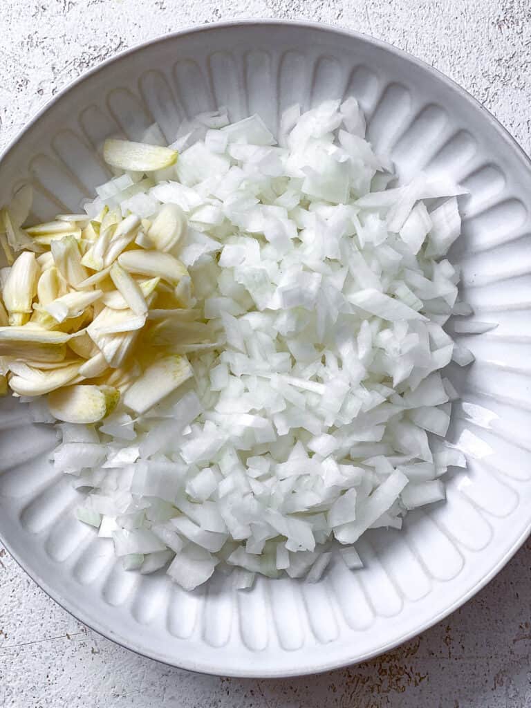 onions and garlic on a bowl