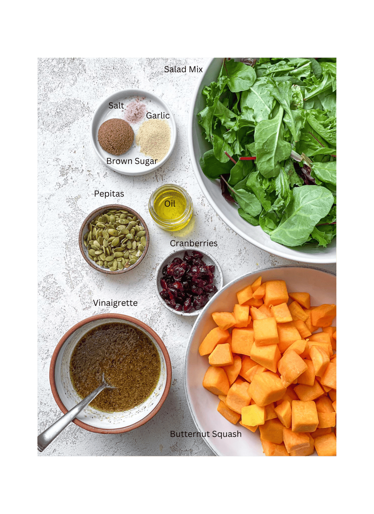 ingredients for Easy Roasted Pumpkin Salad measured on a white surface