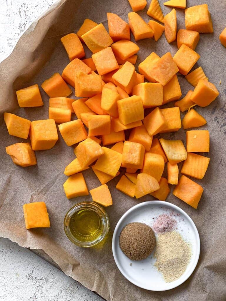 process shot of cubed pumpkin in a baking dish