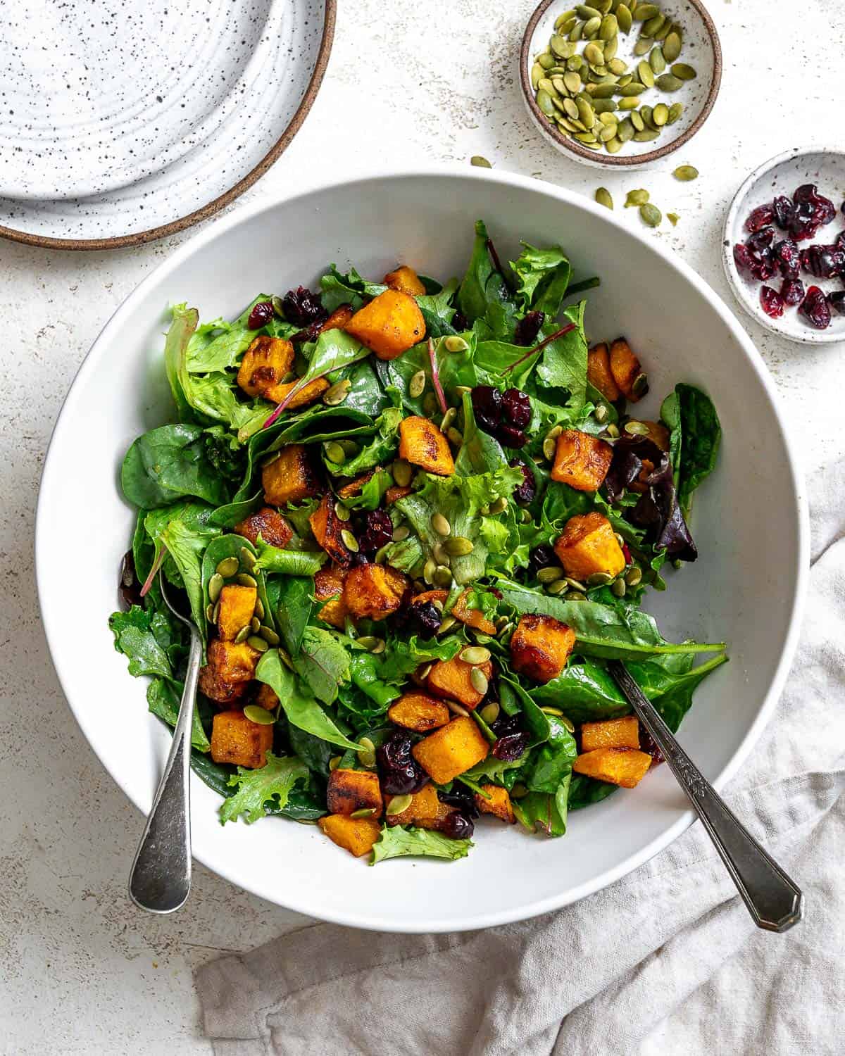 completed Easy Roasted Pumpkin Salad plated on a white surface