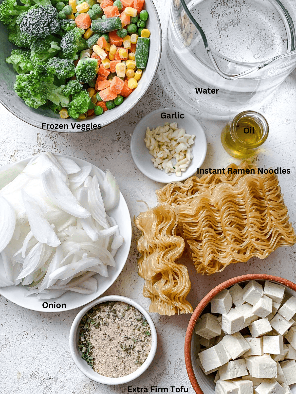 ingredients for 10-Minute Vegan Ramen [With Instant Ramen] on a white surface