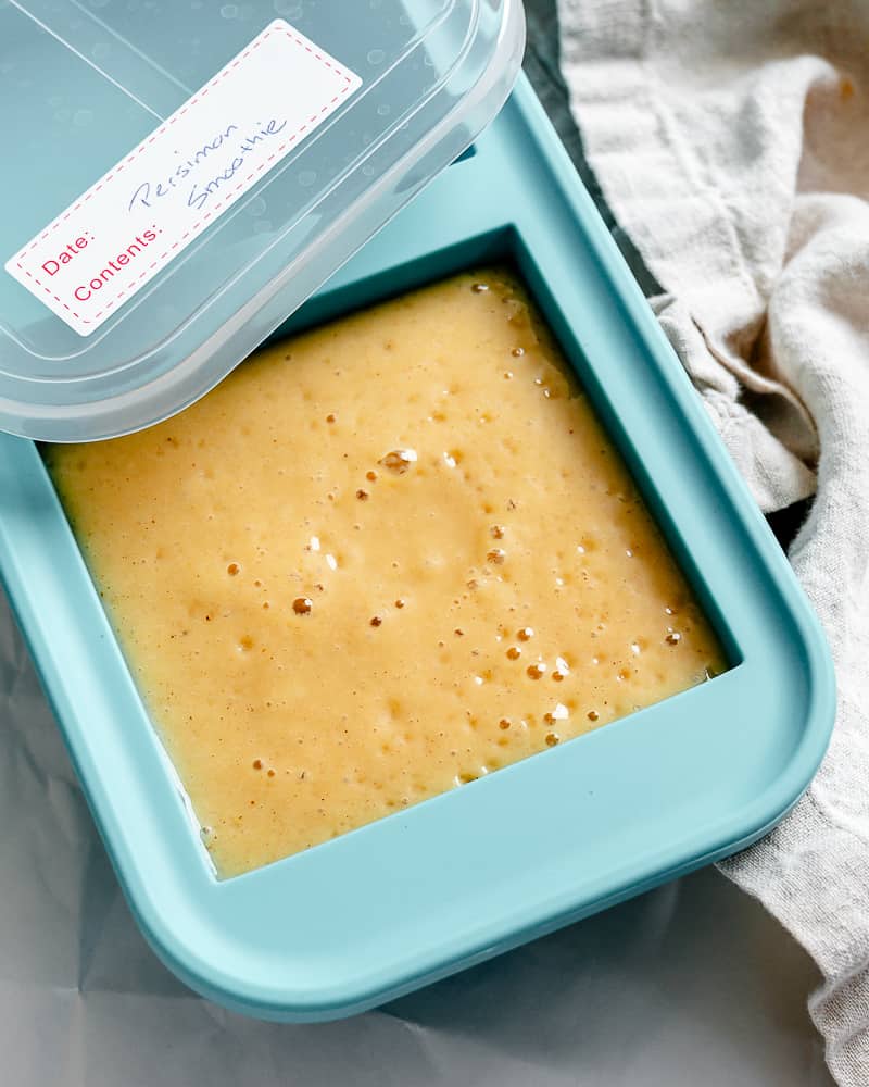Spiced Persimmon Smoothie in a storage container