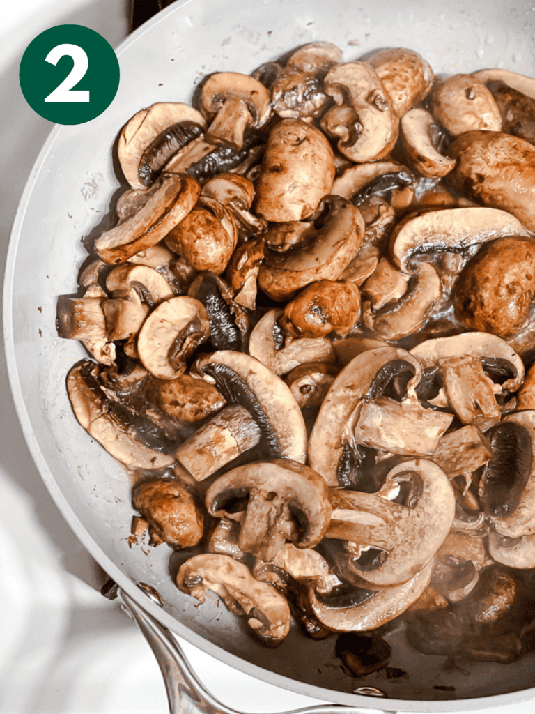 process shot of cooking mushrooms in a pan