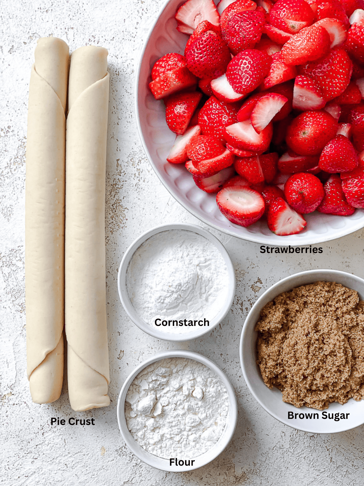 ingredients for Easy Strawberry Pie on a white surface