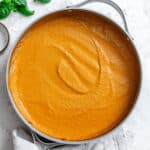 completed Creamy Tomato Tofu Pasta Sauce on a white surface