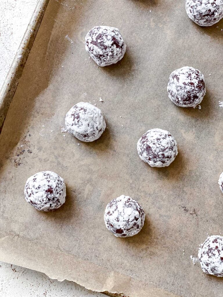 process shot showing pre-baked cookies on baking sheet