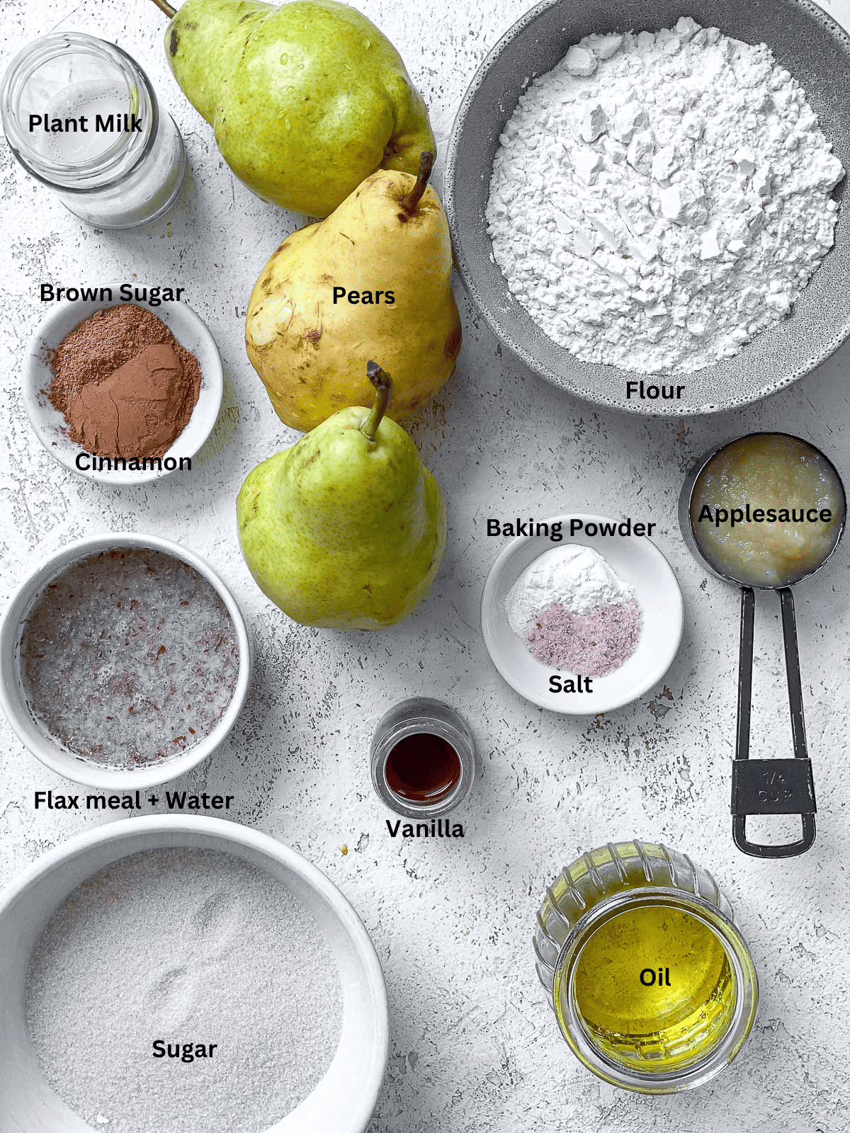 ingredients for Vegan Pear Cake on a white surface