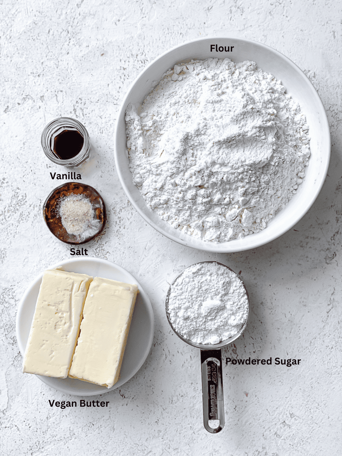 ingredients for Easy Snowball Cookies [Various Flavors] on a white surface