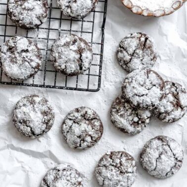 completed Vegan Chocolate Crinkle Cookies on a white surface