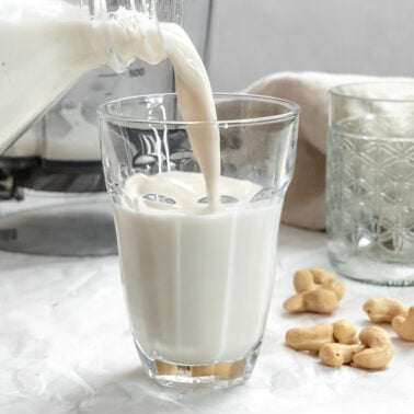 completed Cashew Milk being poured into a glass