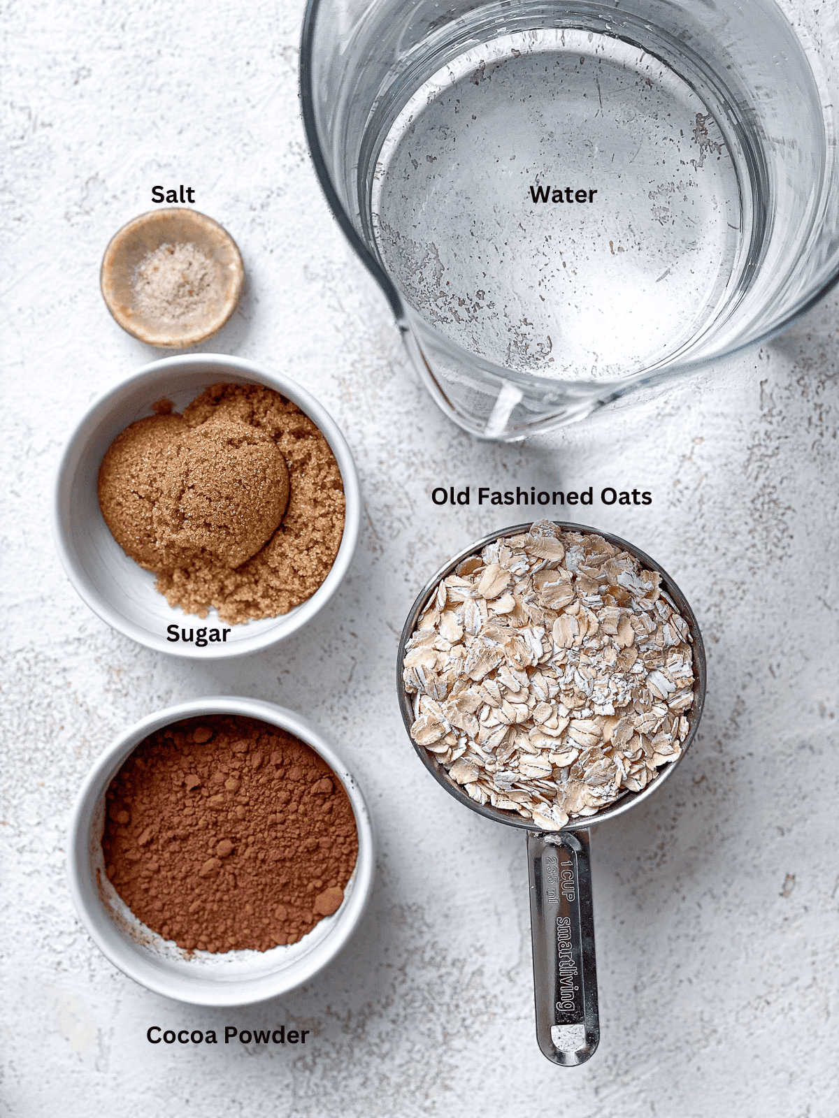 ingredients for Chocolate Oat Milk on a white surface