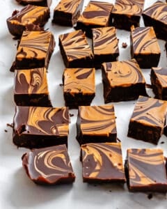 completed Easy Biscoff Fudge [2-Ingredient] in squares on a white surface