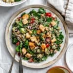completed Kale Quinoa Salad plated on a white surface