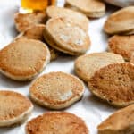 several completed Easy Vegan Pancakes [Regular or Mini] on a white surface