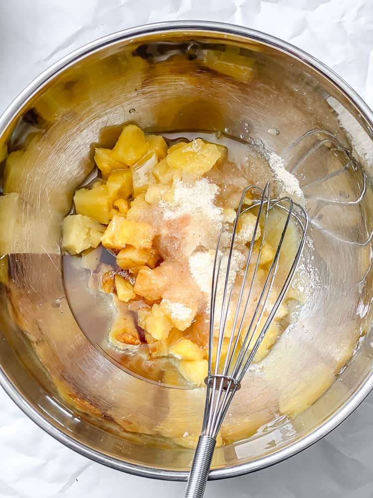 process shot of mixing ingredients together in a bowl