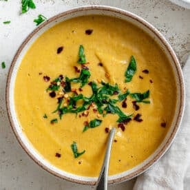 completed Slow Cooker Pumpkin Soup on a white surface