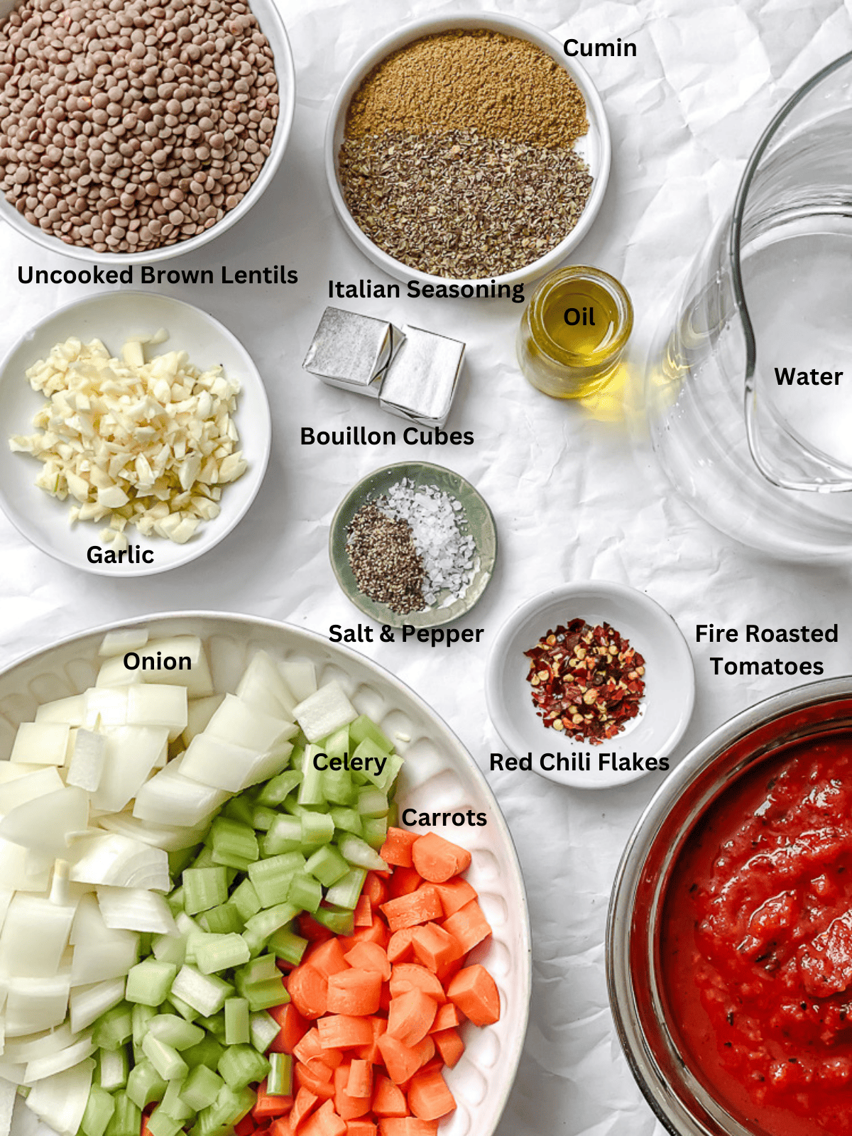 ingredients for Spicy Lentil Soup on a white surface