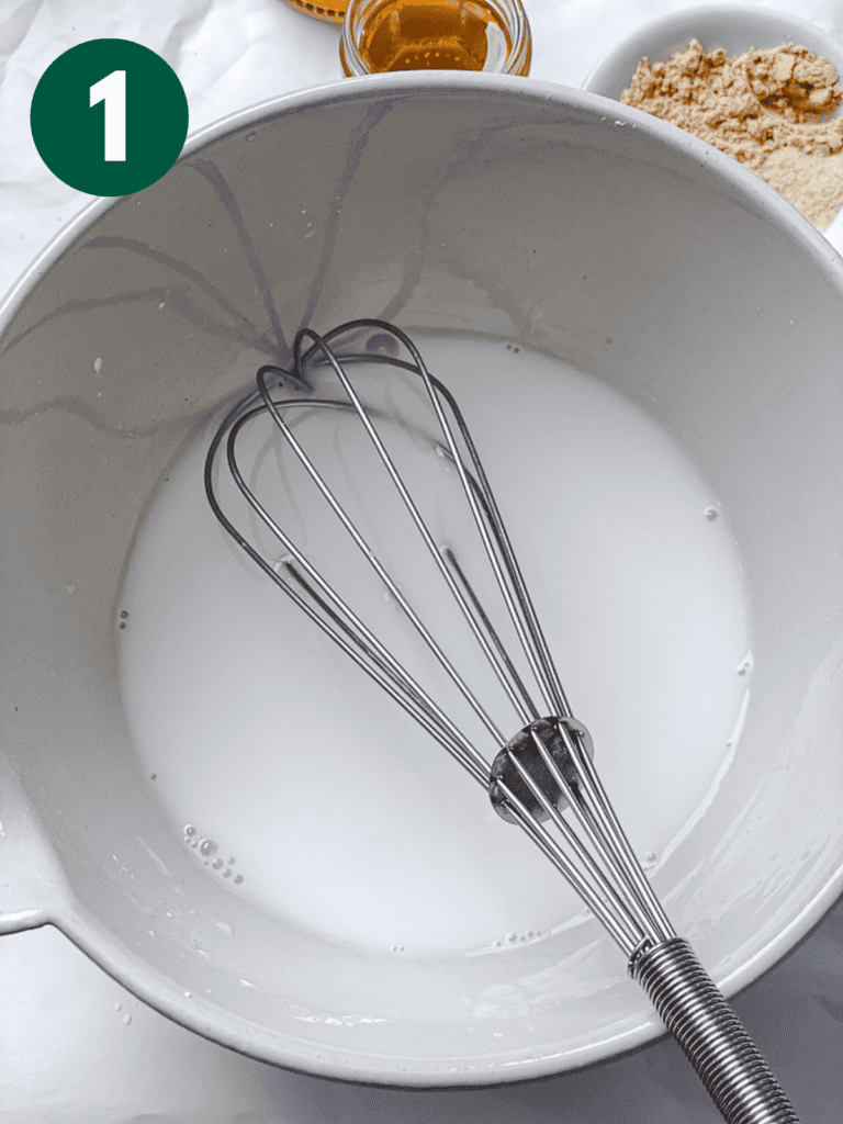 process s،t of whisking cornstarch mixture in bowl