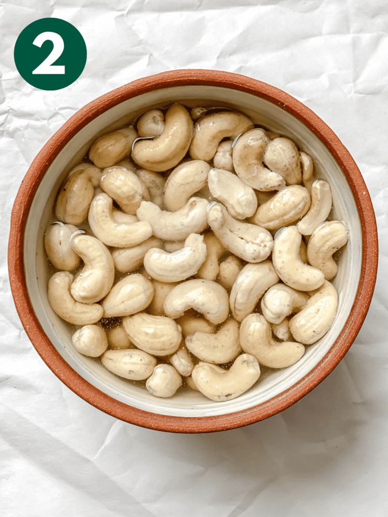 process shot showing cashews soaking in bowl