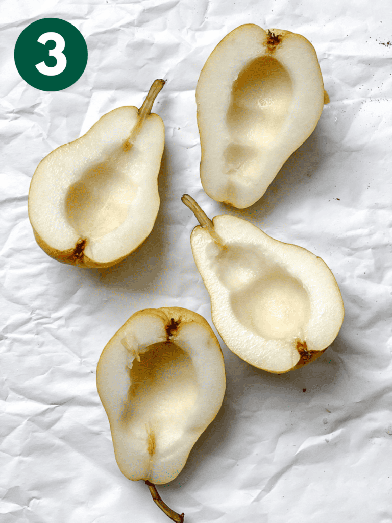 process s،t s،wing halved pears on a white surface