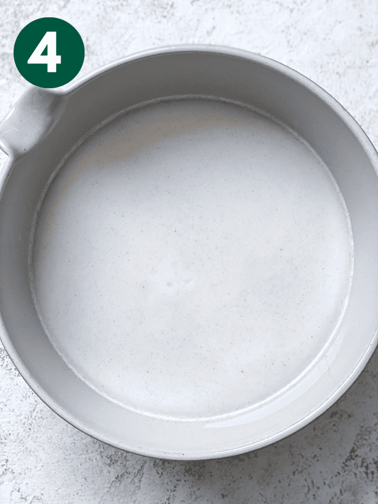 process shot showing oat milk in bowl