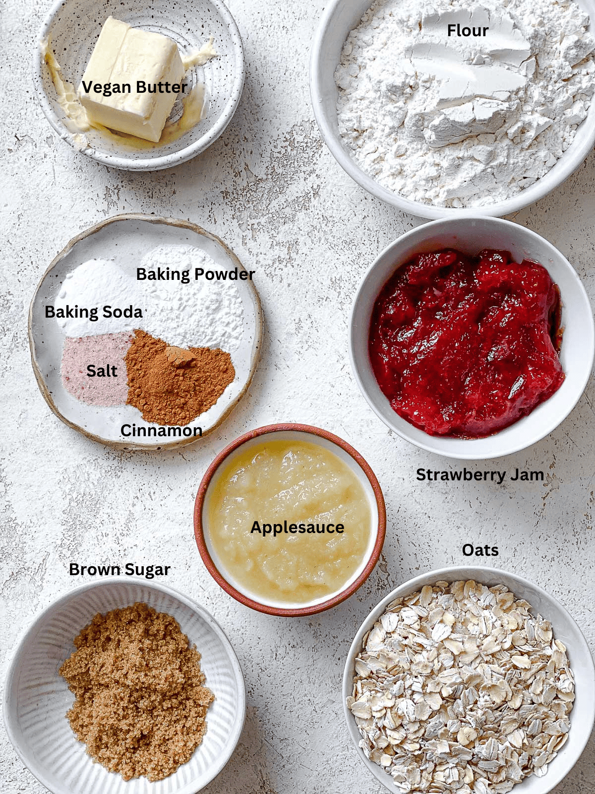 ingredients for Easy Strawberry Oatmeal Bars on a white surface